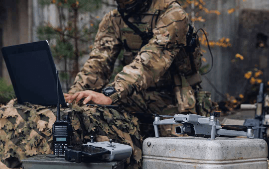 A soldier working with a drone.